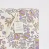 Vibrant floral print gift bag with purple and gold accents, perfect for special occasions, made from recycled cotton paper, showcasing eco-friendly craftsmanship by Paper Mirchi.