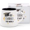 Graduation-themed ceramic mug with "Go Change the World" motivational quote and graduation cap graphic, perfect for students and grads from The Wraperie.