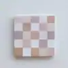Soft pastel checkerboard pattern on paper wrapping at The Wraperie, a specialty wrapping paper shop. Perfect for elegant gift wrapping with subtle, neutral tones.