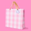Pink checkered shopping bag with beige ribbon handles and “Thank You” heart tag - Popular gift and retail packaging from The Wraperie.