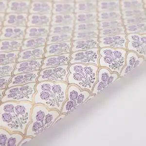 Elegant floral wrapping paper with purple flower patterns and gold accents, perfect for gift wrapping and special occasions.