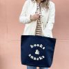 Books and snacks tote bag, ideal for reading enthusiasts and snack lovers, featuring a stylish navy design with white text. Perfect for carrying books, snacks, or groceries with a fun, casual vibe.