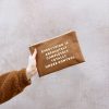 Vegan leather clutch bag with motivational quote, stylish fashion accessory, and trendy design. Perfect for casual outings and adding a touch of inspiration to your look.
