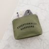 Reusable travel toiletry bag with toothbrush, toothpaste, and towel inside, featuring the phrase 