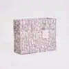Vegan floral print canvas shopping bag with durable cream-colored handles, perfect for eco-friendly grocery shopping or gifting, featuring the unique 