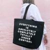 Versatile black Tote Bag with bold white quote 