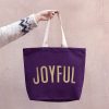 Bright purple tote bag with 