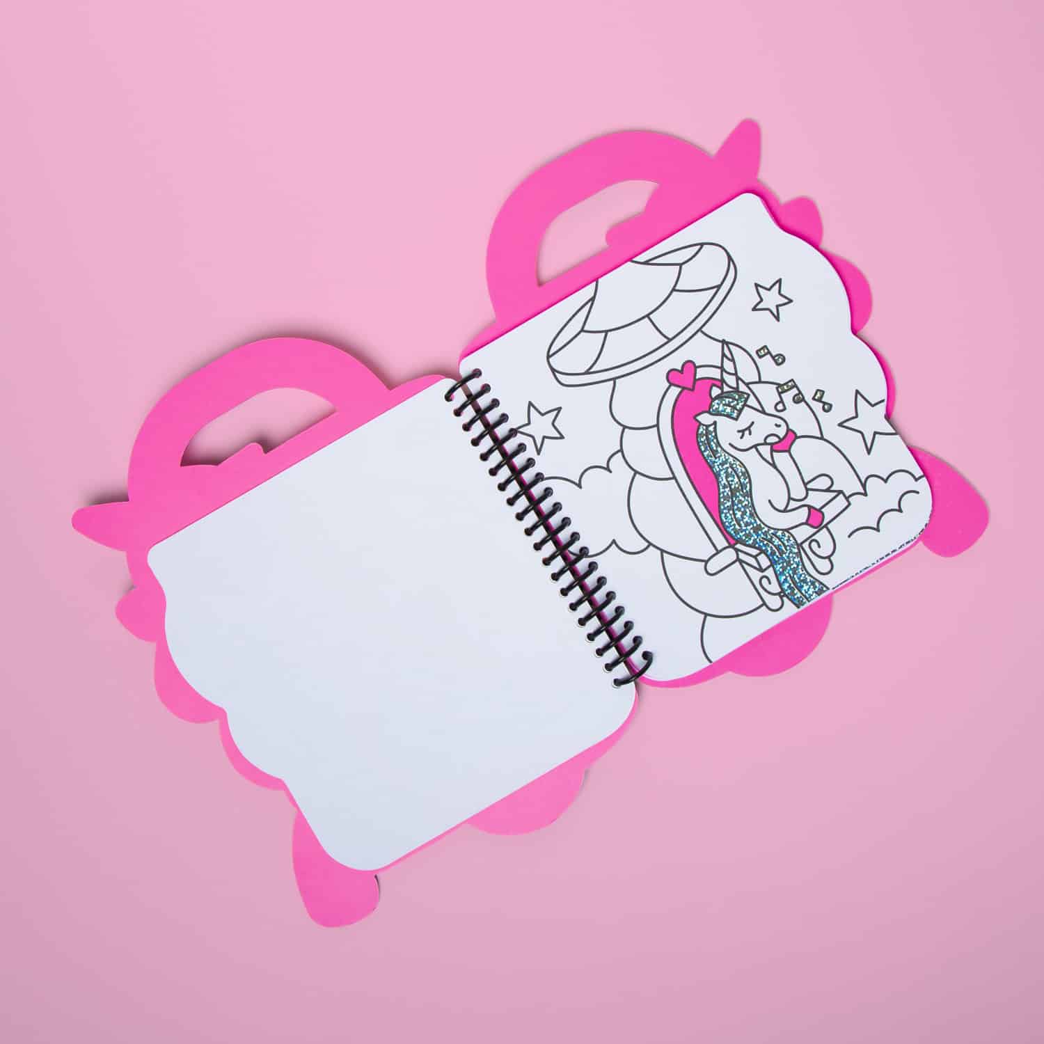 Coloring book with unicorn and carousel design, perfect for kids' entertainment, featuring glitter accents and a pink unicorn theme. Great for children's activities and creative play at The Wraperie.