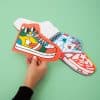 Colorful sneaker-shaped and shoe-themed paper cutouts featuring vibrant, playful designs perfect for arts, crafts, or kids' activities at The Wraperie. Bright, fun, and creatively inspiring.