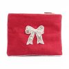 Pearl-embellished pink velvet clutch bag with embroidered bow design, perfect for special occasions and elegant events. Made by The Wraperie, combining luxury and style.