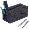 Colorful geometric-patterned pen and desk organizer with pens and highlighters.