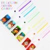 Colorful marker bottles with illustrated girl designs and rainbow streaks; creative accessories from The Wraperie.
