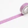 Pink and purple striped decorative washi tape roll perfect for crafts, gift wrapping, and DIY projects. Adds a colorful touch to creative designs and home decor.
