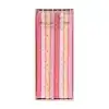 Pink and cream birthday candles with star and polka dot patterns, ideal for celebration decor.
