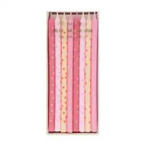 Pink and cream birthday candles with star and polka dot patterns, ideal for celebration decor.