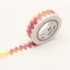 Colorful decorative washi tape with zigzag pattern in pink, yellow, and orange; perfect for scrapbooking and craft projects.