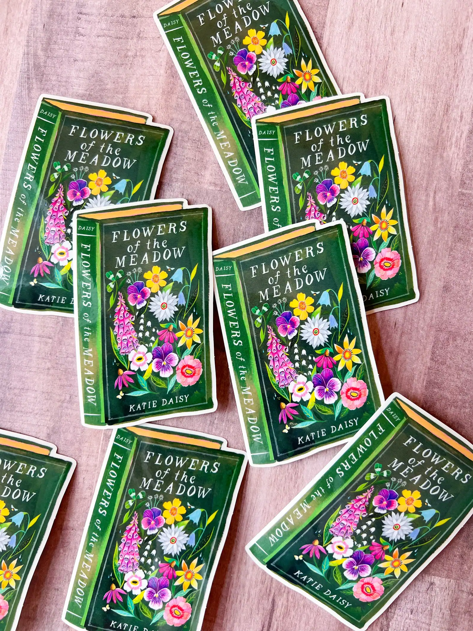 Vibrant flower seed packet designs for "Flowers of the Meadow" by Katie Daisy, featuring colorful wildflowers on a deep green background, perfect for garden enthusiasts and flower lovers.