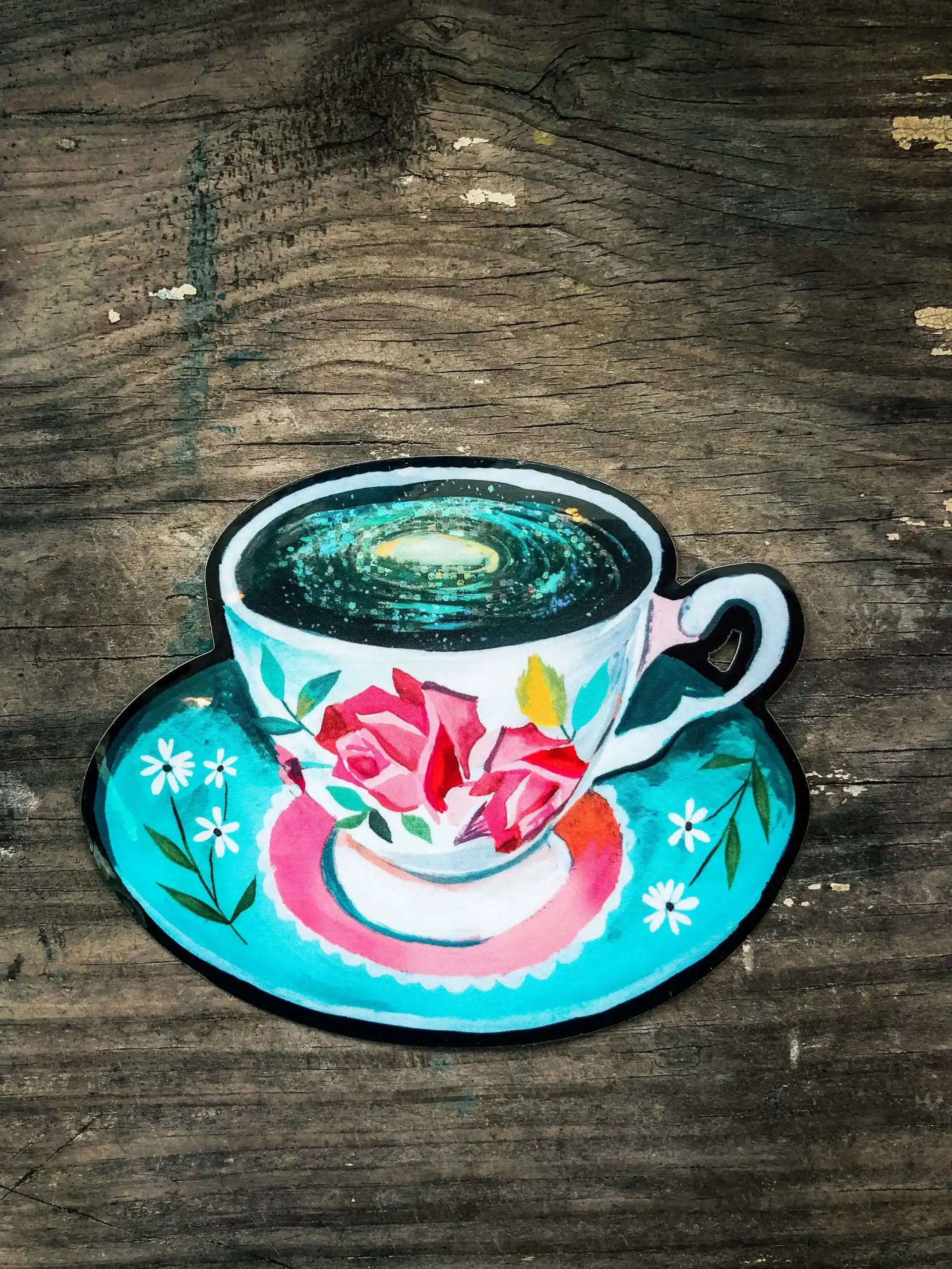 Hand-painted tea cup illustration featuring floral designs, perfect for bakery and cafe branding, with vibrant colors and artistic style.