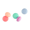 Mini colorful macarons in pastel shades on a plain background.