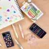 Bright neon gel pens, colorful phone cases, and cute stationery on a wooden desk, perfect for creative journaling and decorating.