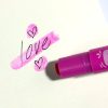 Bright pink marker creates the word 
