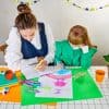 Vibrant children's birthday party setup with colorful decorations, drawing activity, and engaging workspace, perfect for creating joyful memories and celebrating special occasions.