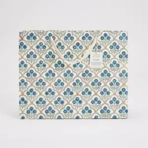 Elegant wrapping paper with a traditional blue floral pattern, perfect for gift packaging and special occasions, made from high-quality recycled paper.