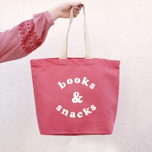 Bright pink books and snacks tote bag